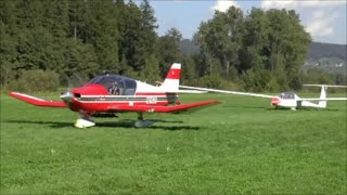 Glider being towed by a plane for takeoff  Amlikon Switzerlan  07092014 [upl. by Hsoj]